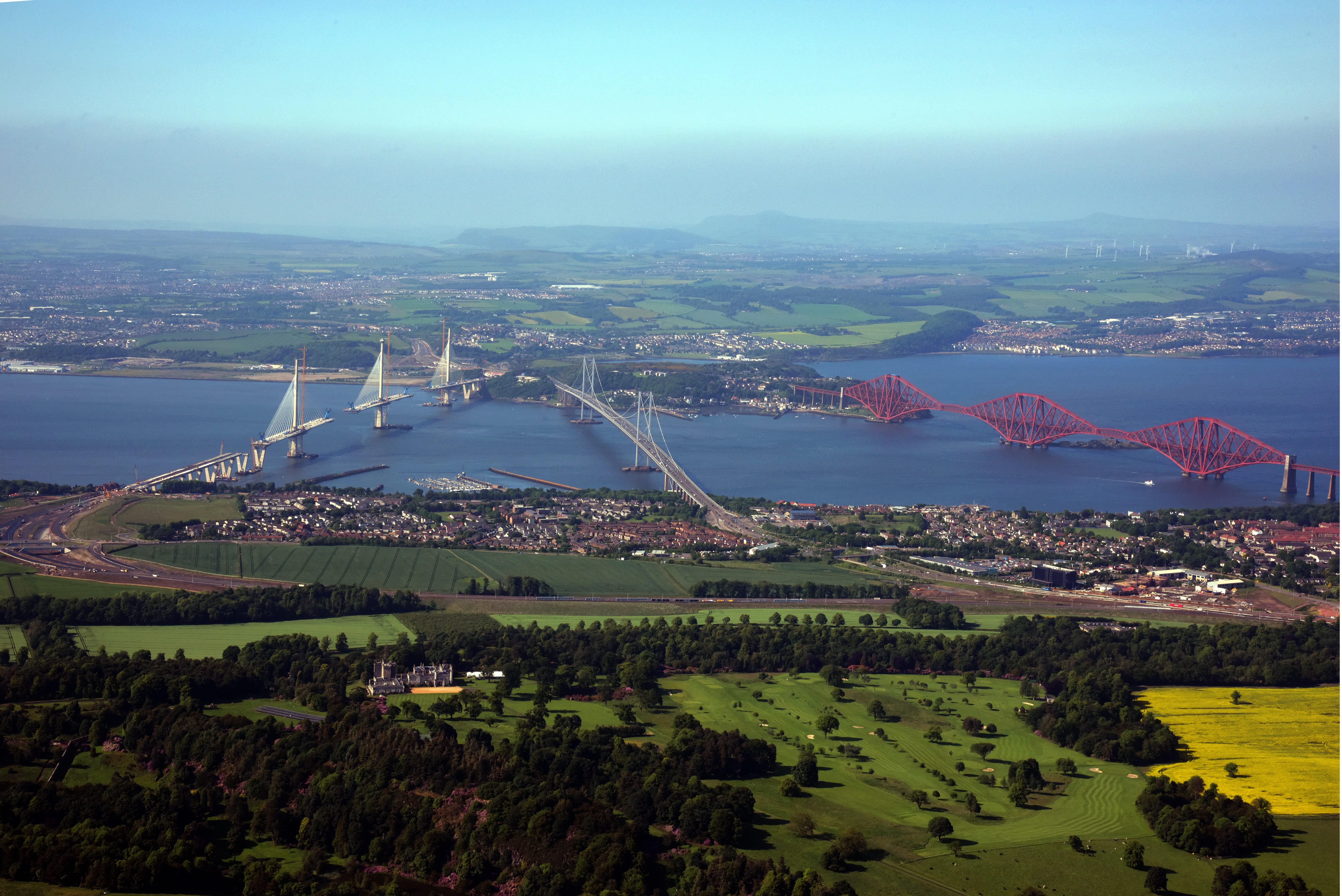 View of bridges over water near golf course
